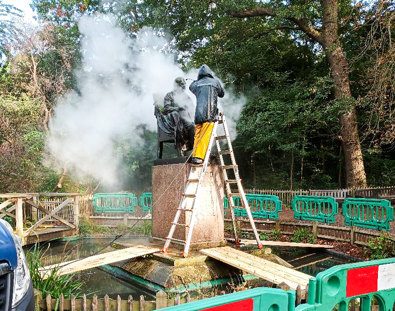 Jet washing statue